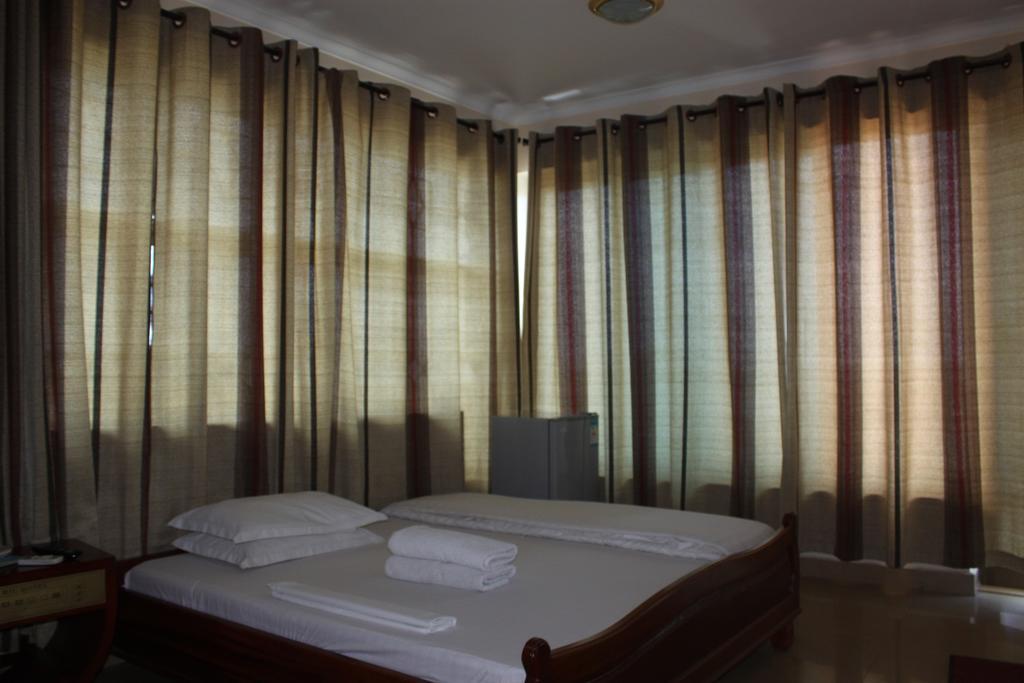 Mic Hotel Dar es Salaam Quarto foto